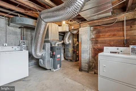 a view of walk in closet with stairs