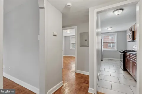a view of a kitchen from the hallway