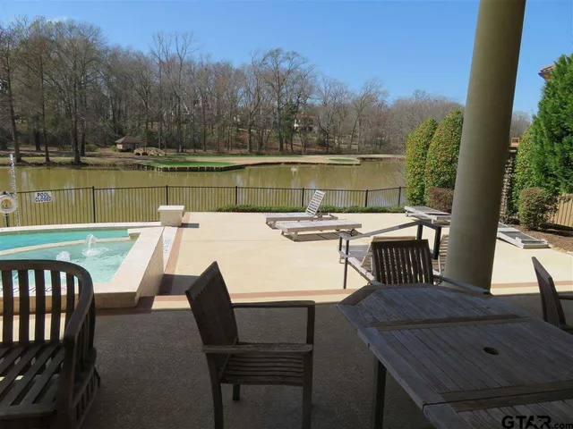 a front view of a house with outdoor seating