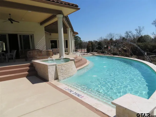 a kitchen with stainless steel appliances granite countertop a stove and a refrigerator