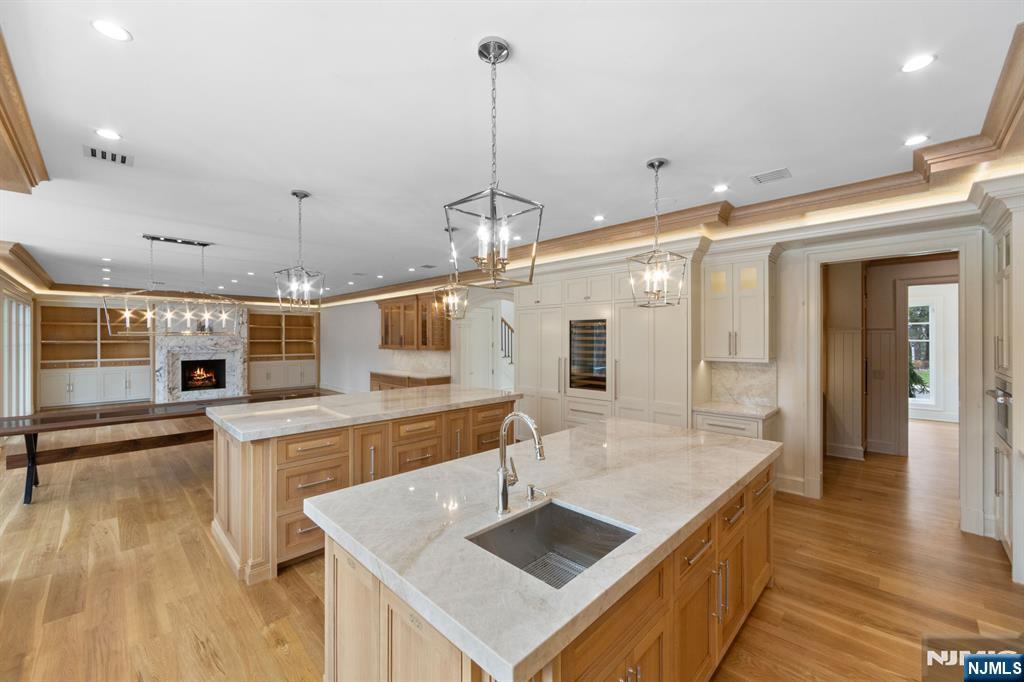 104 Chestnut Ridge Road Saddle River, NJ 07458 - Photo 12 of 47 a kitchen with stainless steel appliances granite countertop a sink a oven and a stove