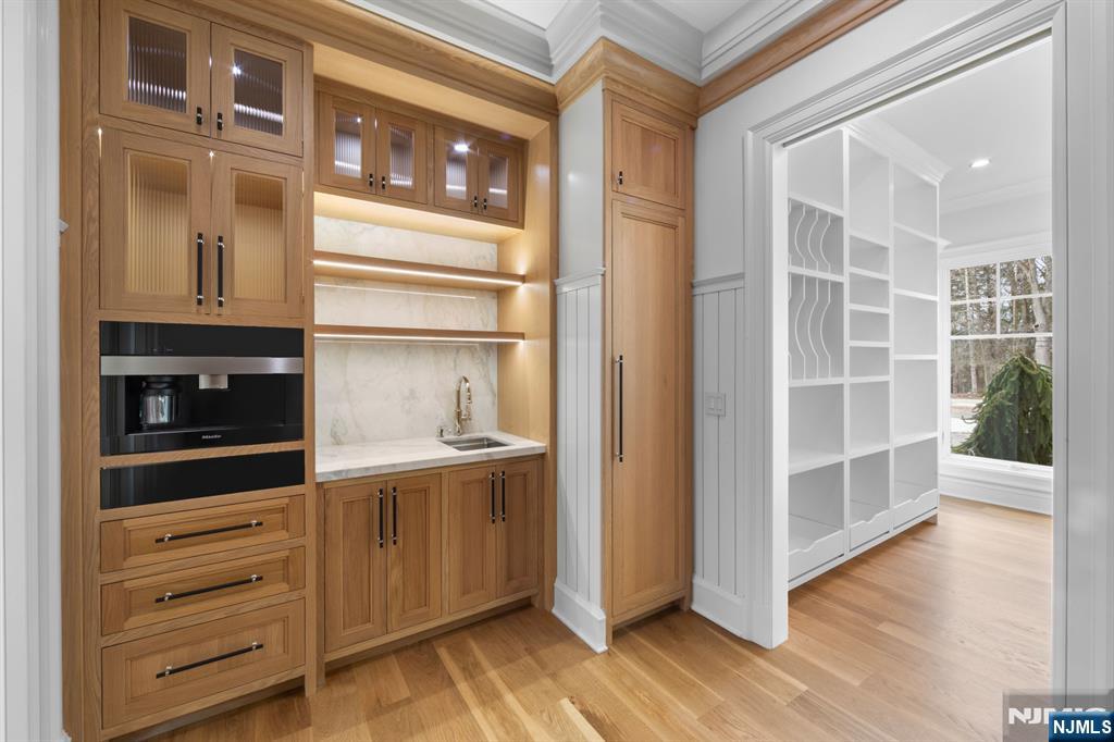 104 Chestnut Ridge Road Saddle River, NJ 07458 - Photo 17 of 47 a view of walk in closet with empty racks