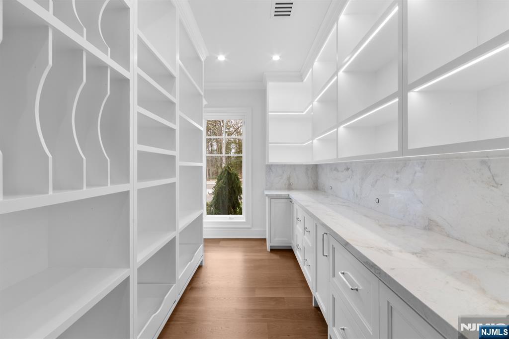 104 Chestnut Ridge Road Saddle River, NJ 07458 - Photo 18 of 47 a view of a kitchen with a sink and a window