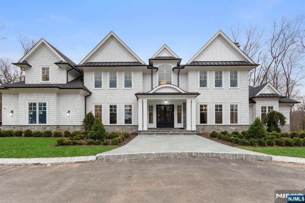 104 Chestnut Ridge Road Saddle River, NJ 07458 - Photo 2 of 47 a view of house with yard and green space