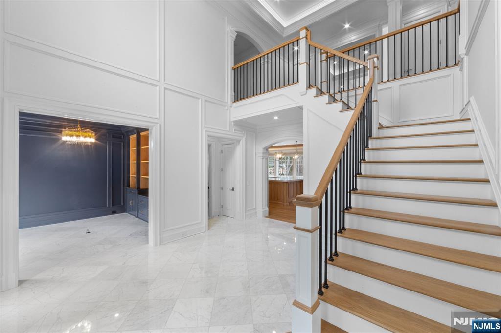 104 Chestnut Ridge Road Saddle River, NJ 07458 - Photo 24 of 47 a view of staircase with white walls and railing
