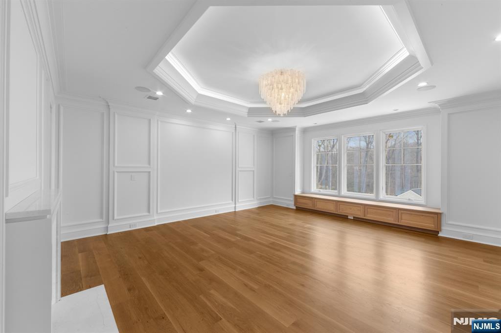 104 Chestnut Ridge Road Saddle River, NJ 07458 - Photo 26 of 47 a view of empty room with wooden floor and window