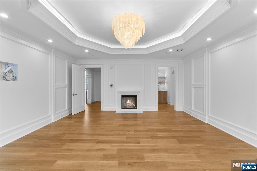 104 Chestnut Ridge Road Saddle River, NJ 07458 - Photo 27 of 47 a view of an empty room with a fireplace