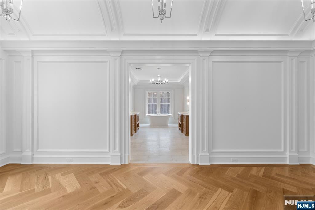 104 Chestnut Ridge Road Saddle River, NJ 07458 - Photo 31 of 47 a view of a room with wooden floor and a window