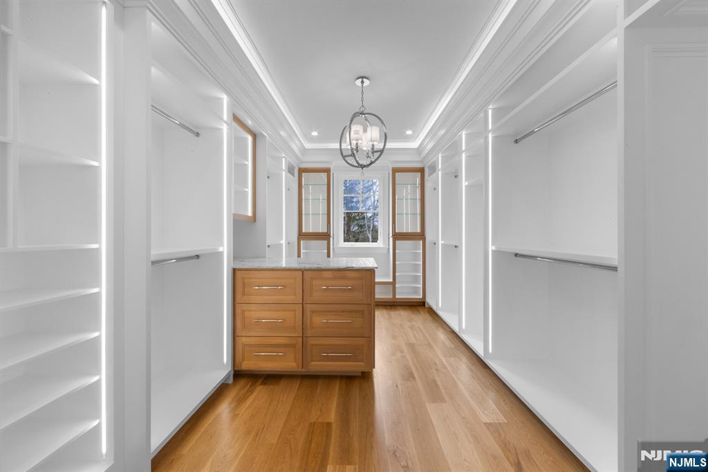 104 Chestnut Ridge Road Saddle River, NJ 07458 - Photo 35 of 47 a view of hall with wooden floor and staircase