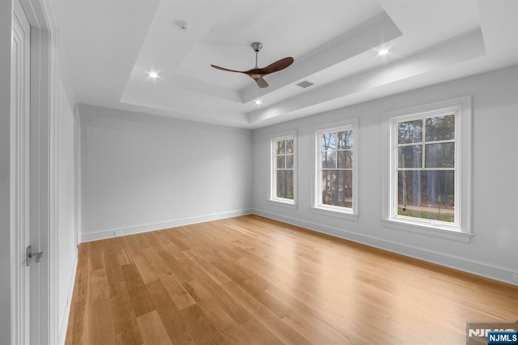 104 Chestnut Ridge Road Saddle River, NJ 07458 - Photo 38 of 47 a view of an empty room with a window and a kitchen