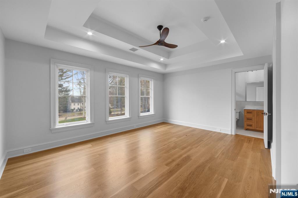104 Chestnut Ridge Road Saddle River, NJ 07458 - Photo 39 of 47 a view of an empty room with a window and wooden floor
