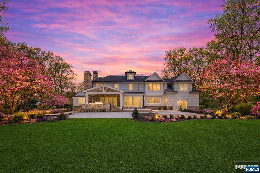 104 Chestnut Ridge Road Saddle River, NJ 07458 - Photo 4 of 47 a front view of a house with a big yard