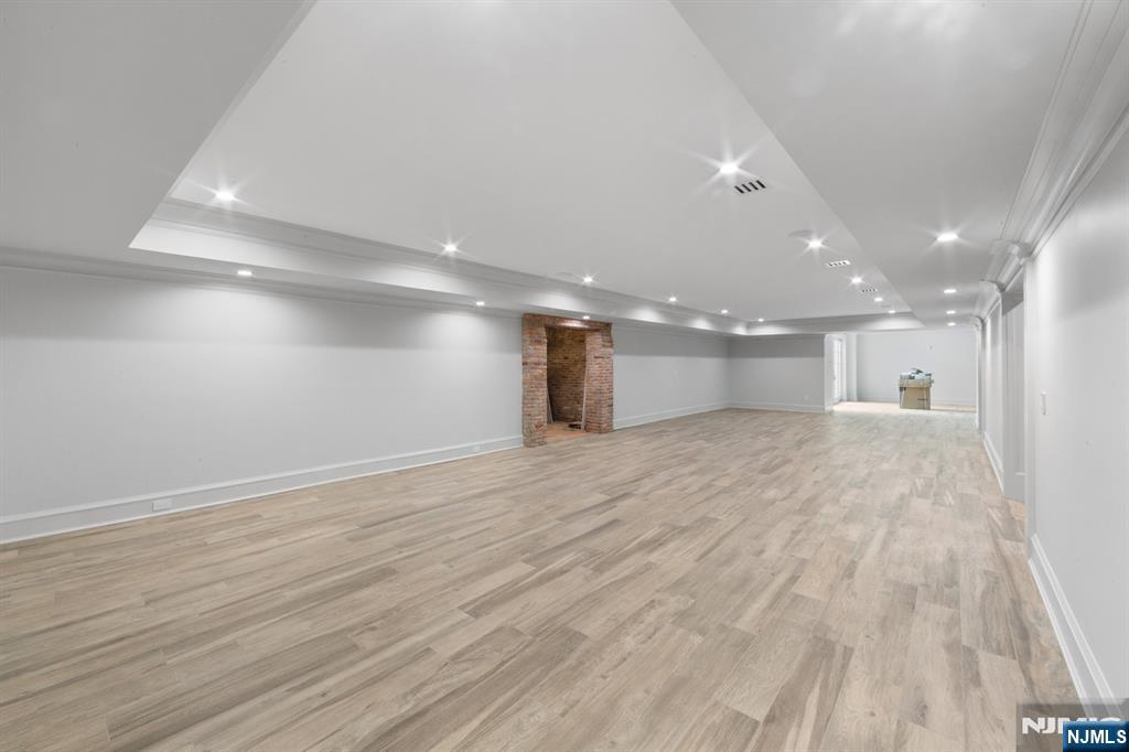 104 Chestnut Ridge Road Saddle River, NJ 07458 - Photo 45 of 47 a view of an empty room with wooden floor