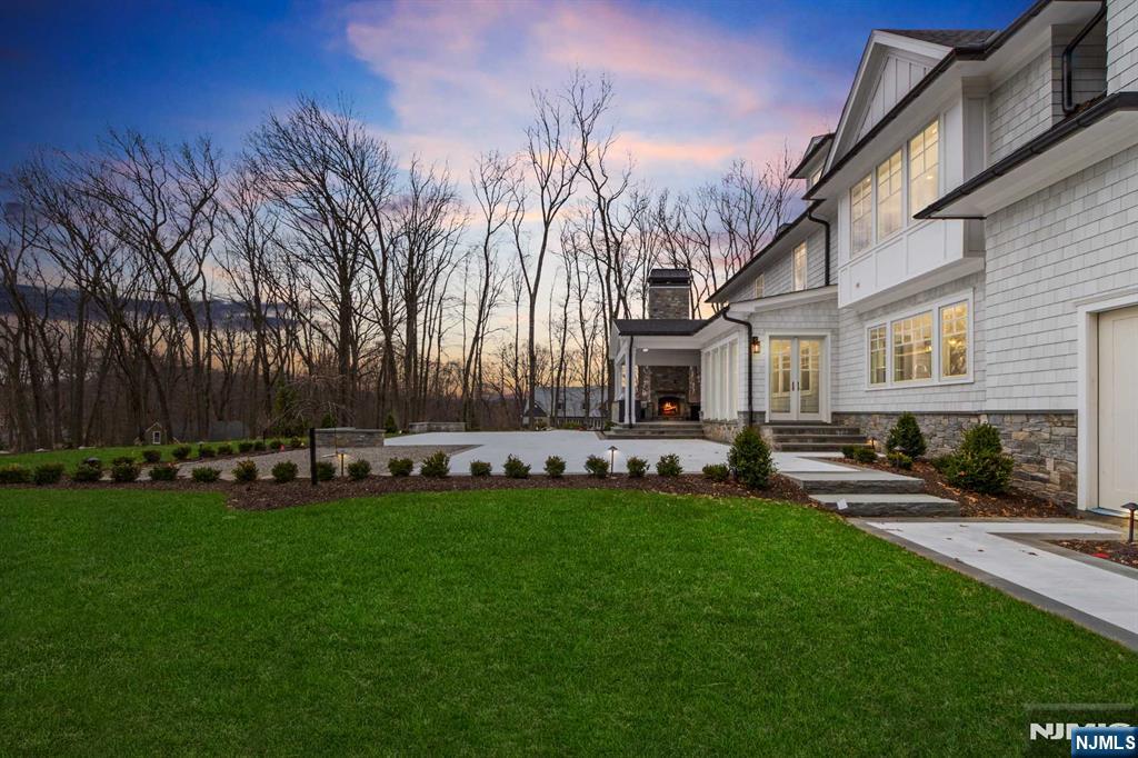 104 Chestnut Ridge Road Saddle River, NJ 07458 - Photo 5 of 47 a view of a house with a back yard