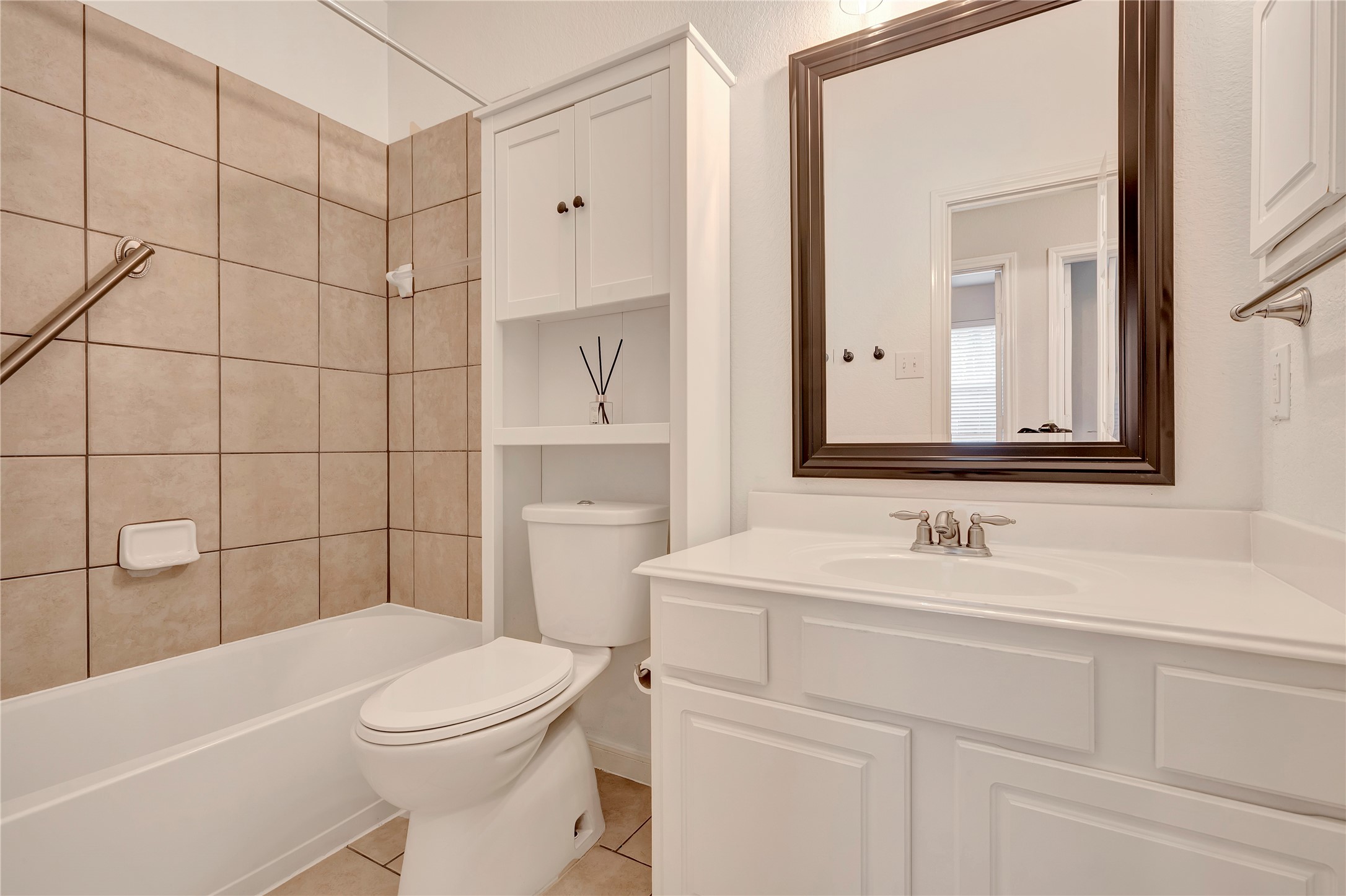 27 Planchard Court Spring, TX 77382 - Photo 12 of 16 a bathroom with a sink a toilet and shower