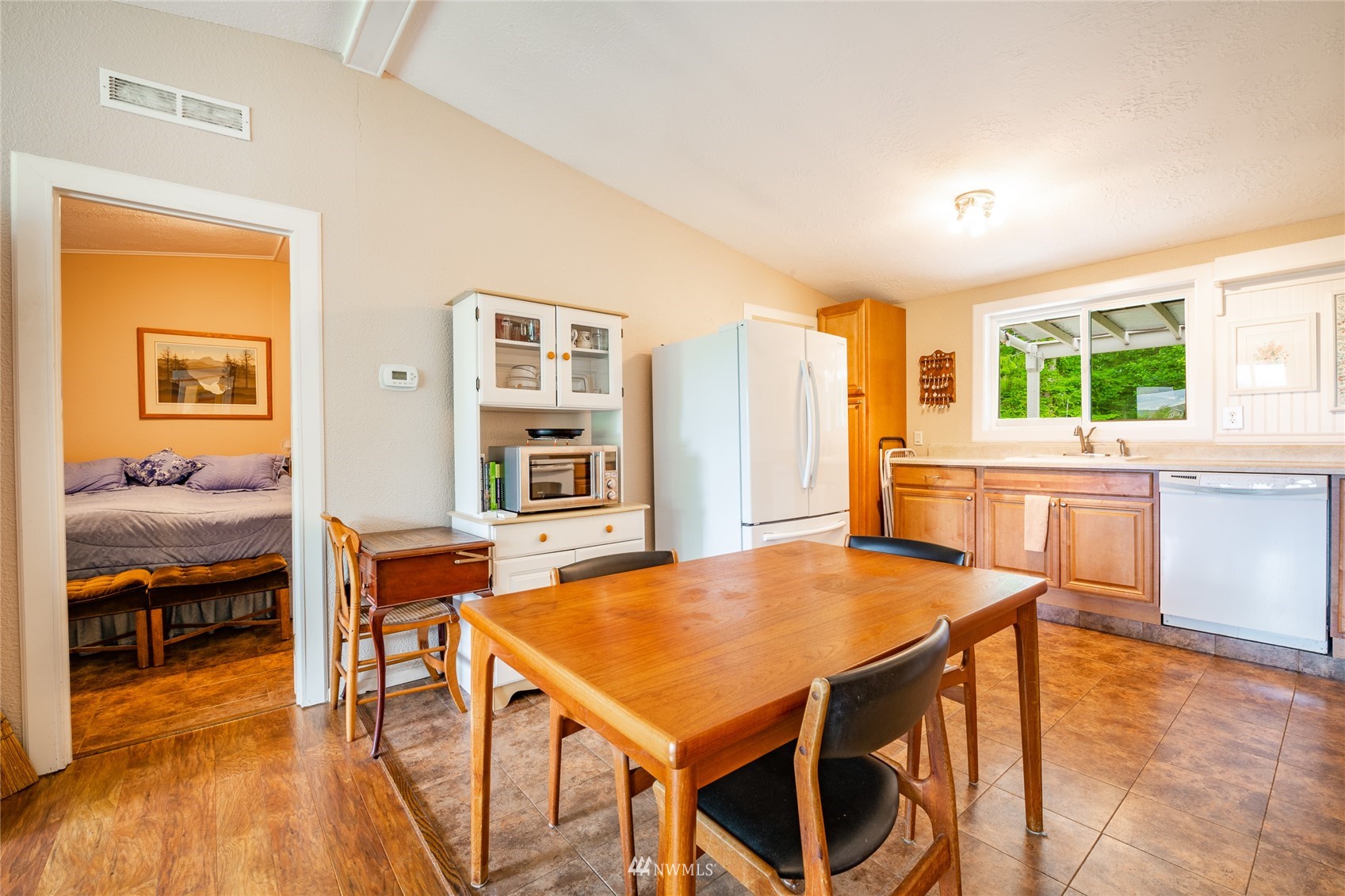 5577 E Road Bellingham, WA 98226 - Photo 14 of 40 a view of a dining room with furniture and wooden floor