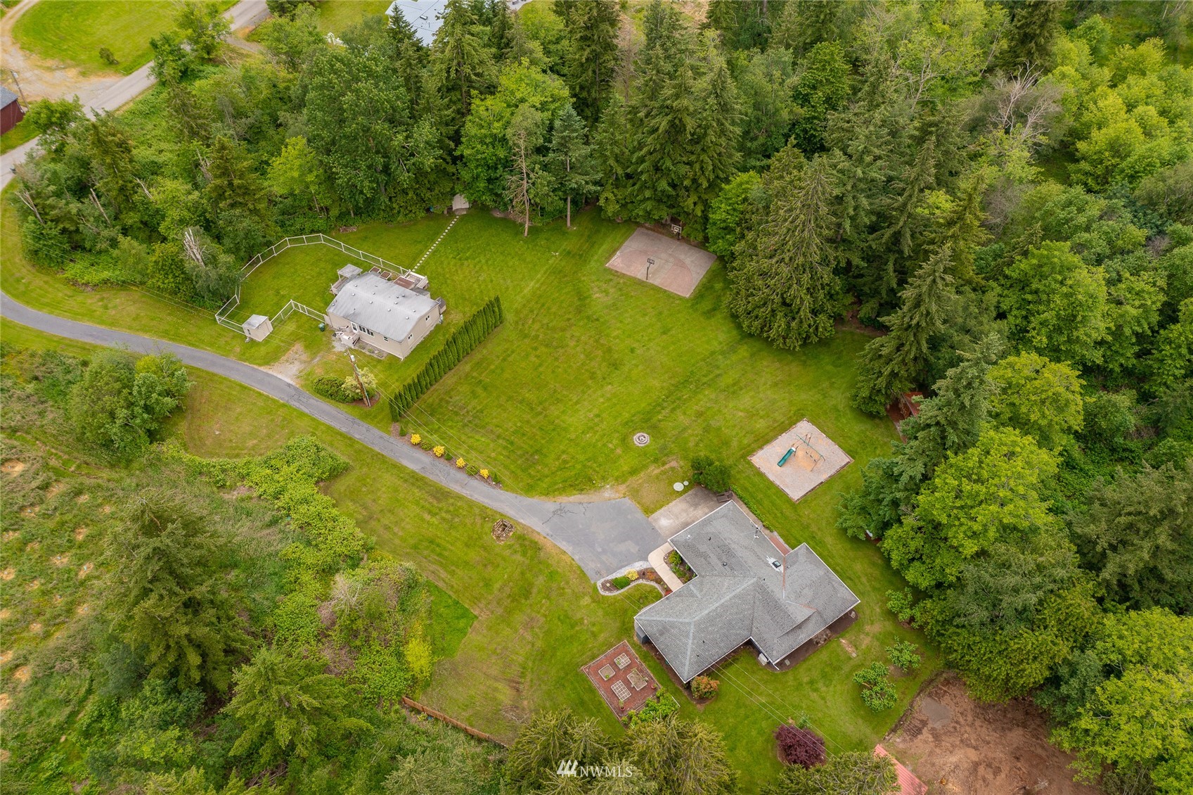 5577 E Road Bellingham, WA 98226 - Photo 2 of 40 an aerial view of a residential houses with outdoor space and trees all around