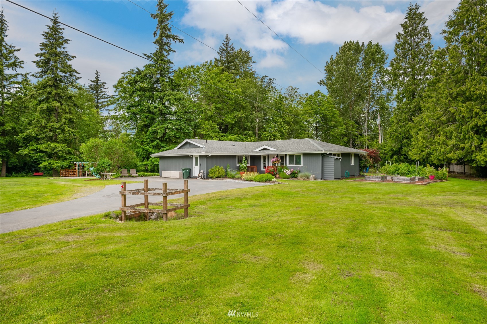 5577 E Road Bellingham, WA 98226 - Photo 21 of 40 a view of a house with a yard balcony and sitting area
