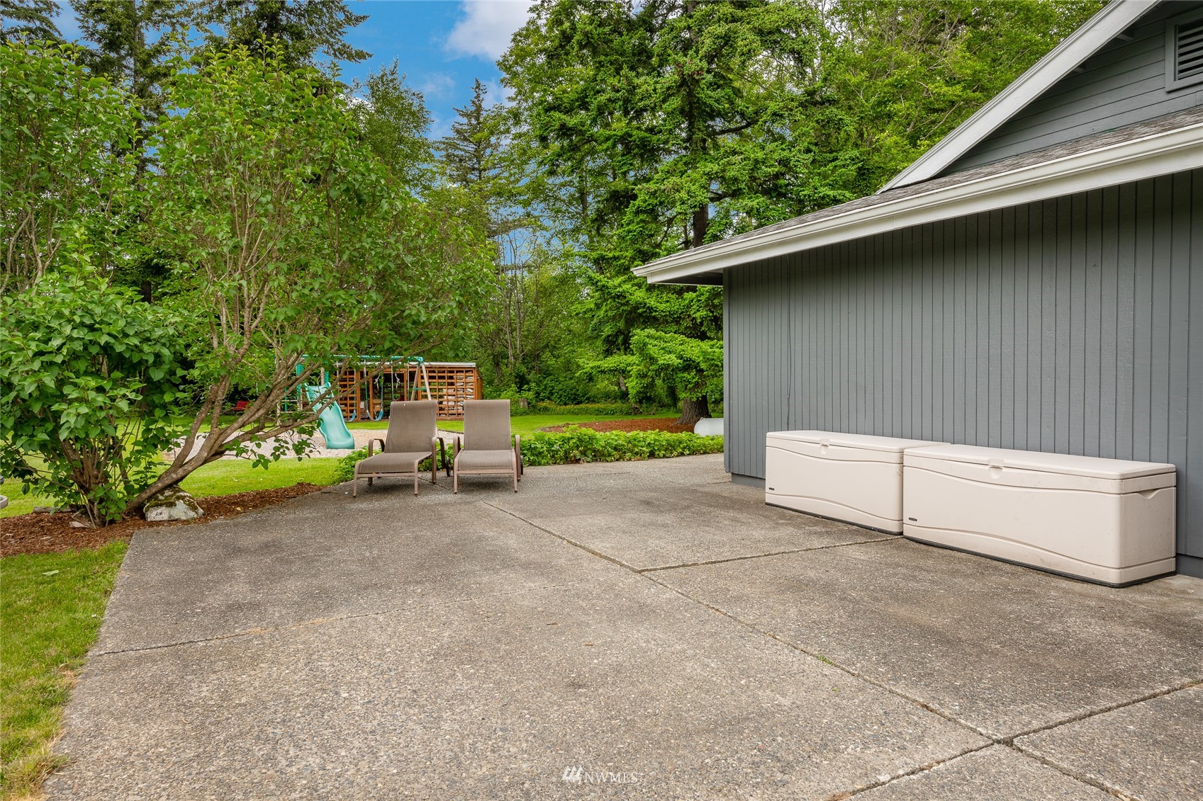 5577 E Road Bellingham, WA 98226 - Photo 23 of 40 a view of backyard with barbeque and wooden fence