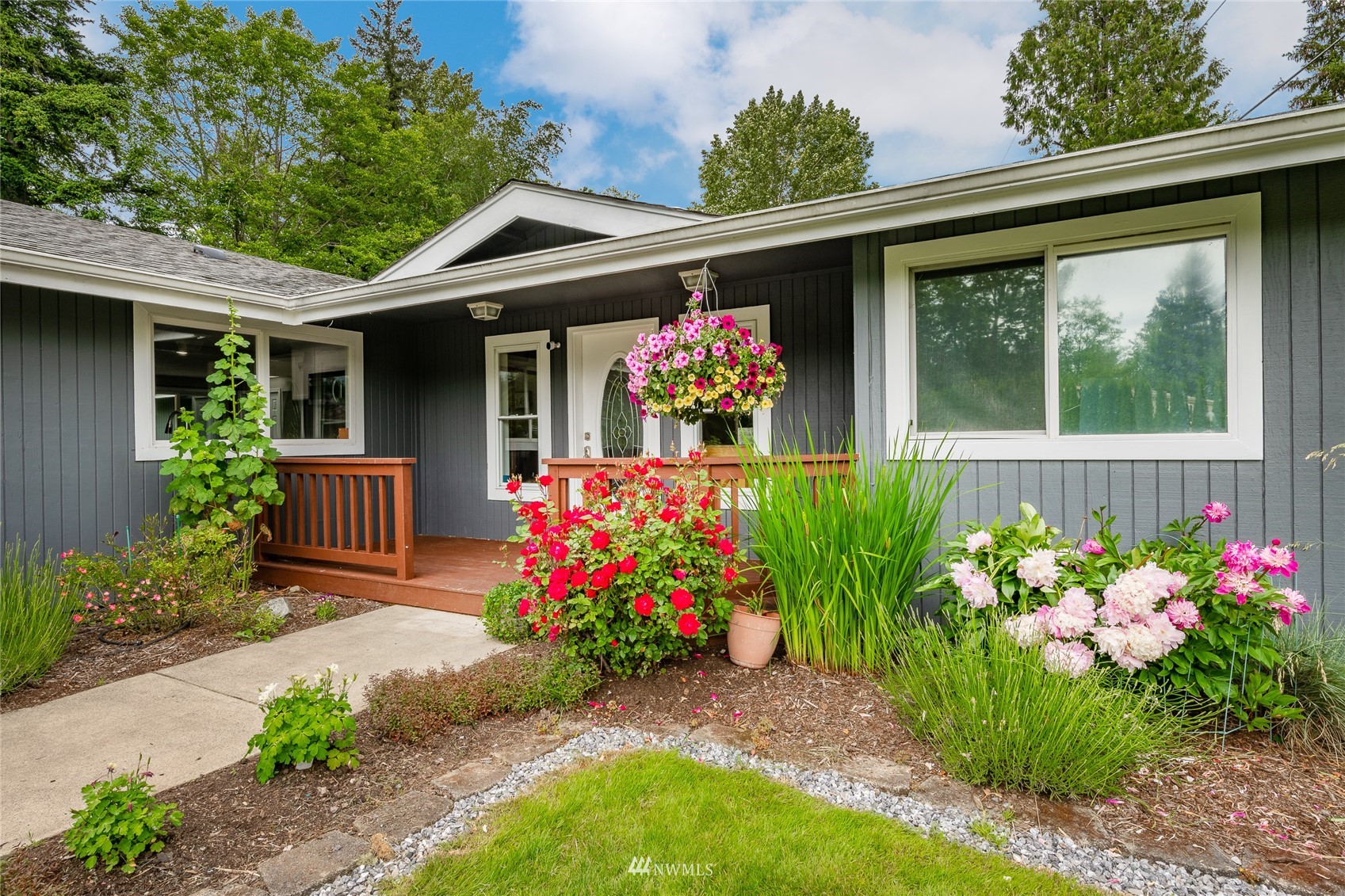 5577 E Road Bellingham, WA 98226 - Photo 28 of 40 a front view of house with a yard and fountain in middle of the house