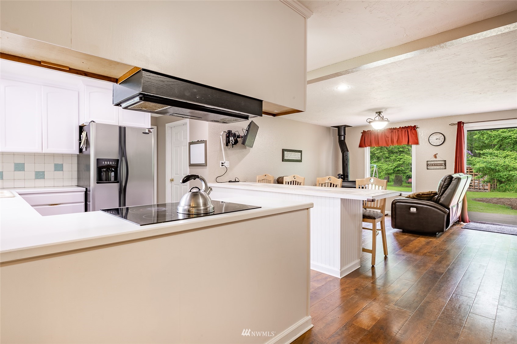 5577 E Road Bellingham, WA 98226 - Photo 30 of 40 a kitchen with kitchen island white cabinets and refrigerator