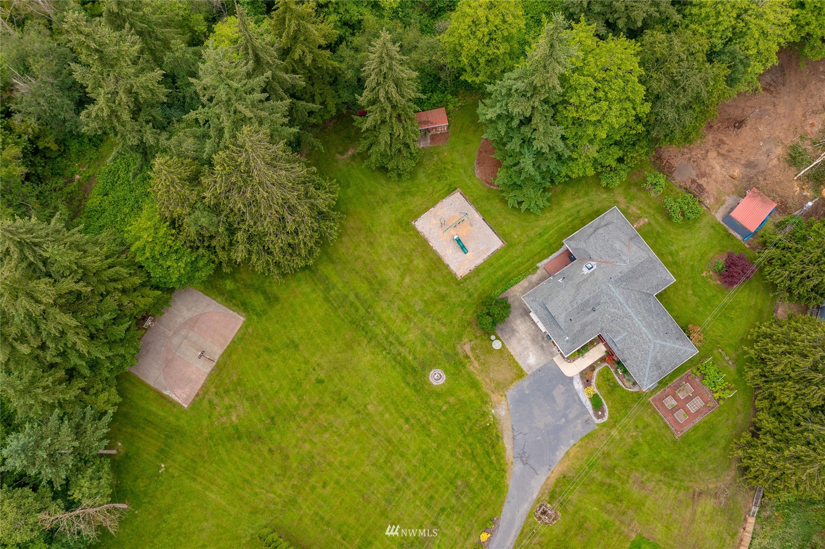 5577 E Road Bellingham, WA 98226 - Photo 3 of 40 an aerial view of a house with garden space and street view