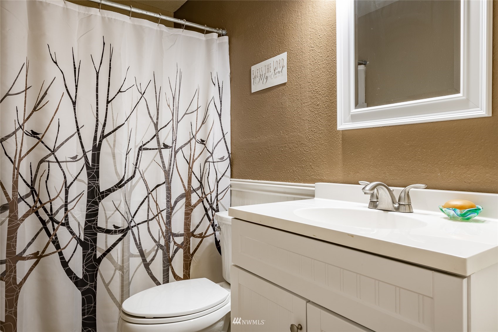 5577 E Road Bellingham, WA 98226 - Photo 36 of 40 a bathroom with a toilet sink and mirror