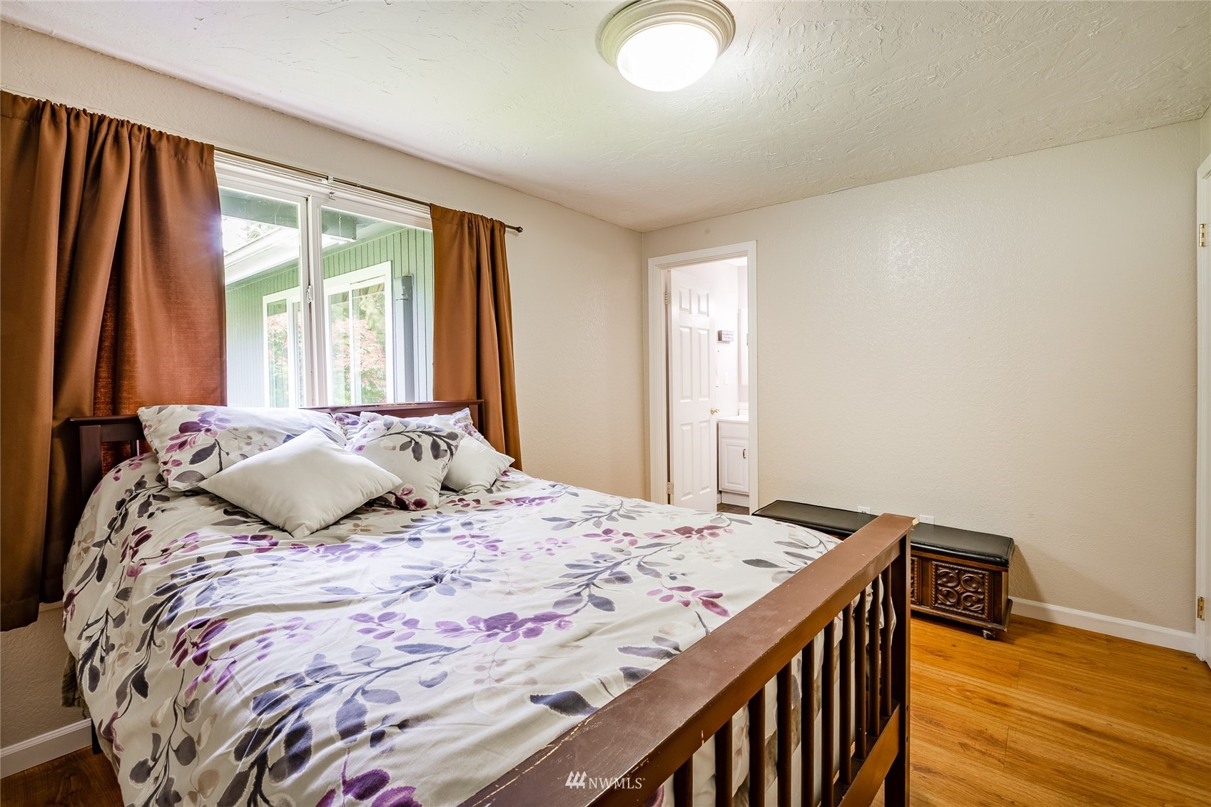 5577 E Road Bellingham, WA 98226 - Photo 38 of 40 a bedroom with a large bed and a window