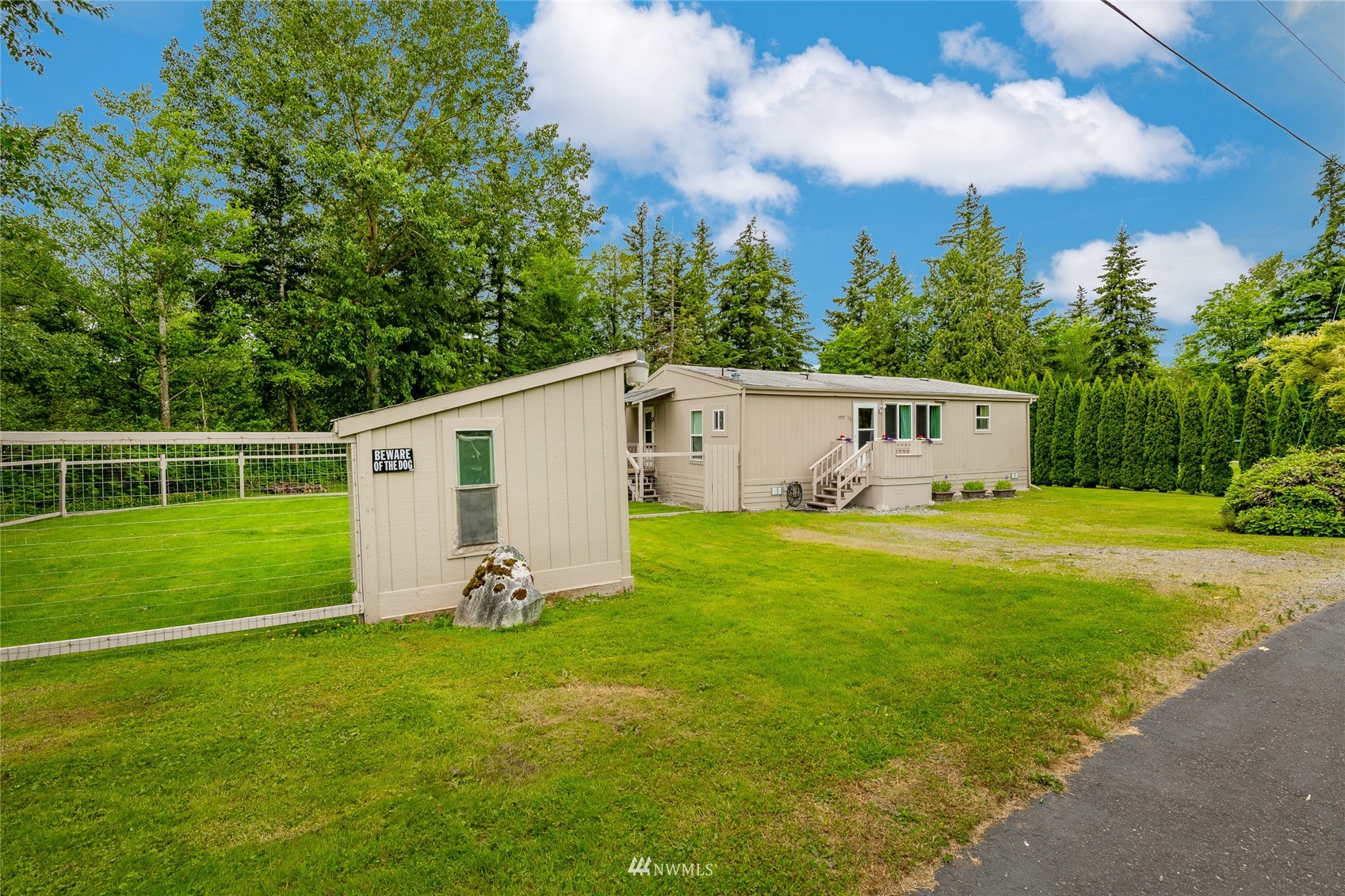 5577 E Road Bellingham, WA 98226 - Photo 6 of 40 a view of a backyard with plants and a garden