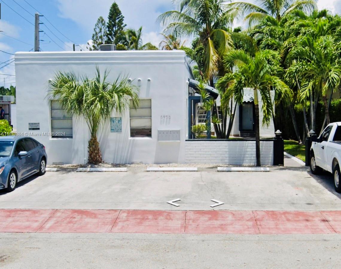 6955 Rue Vendome Miami Beach, FL 33141 - Photo 13 of 43 a view of a house with a yard and garage