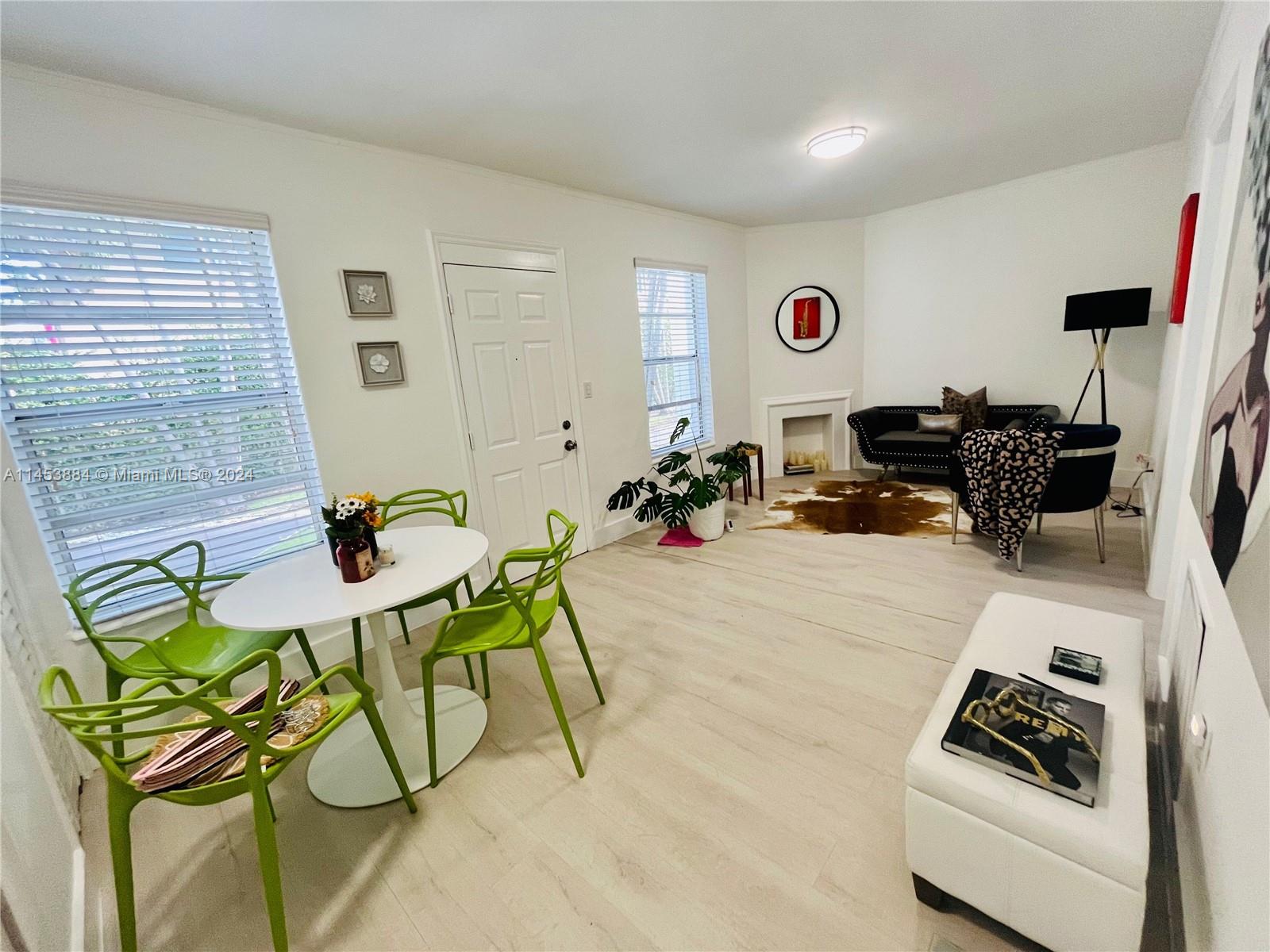 6955 Rue Vendome Miami Beach, FL 33141 - Photo 15 of 43 a living room with furniture and a flat screen tv