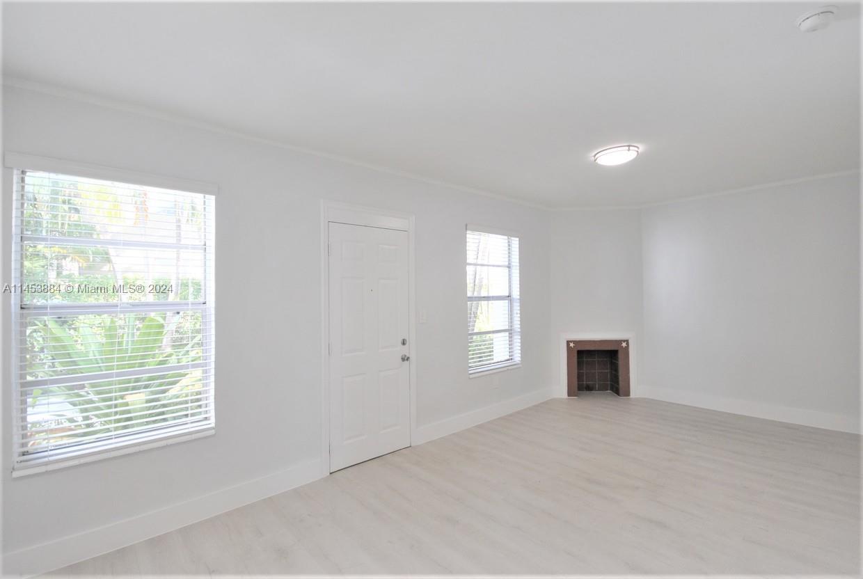 6955 Rue Vendome Miami Beach, FL 33141 - Photo 16 of 43 a view of empty room with a fireplace and window