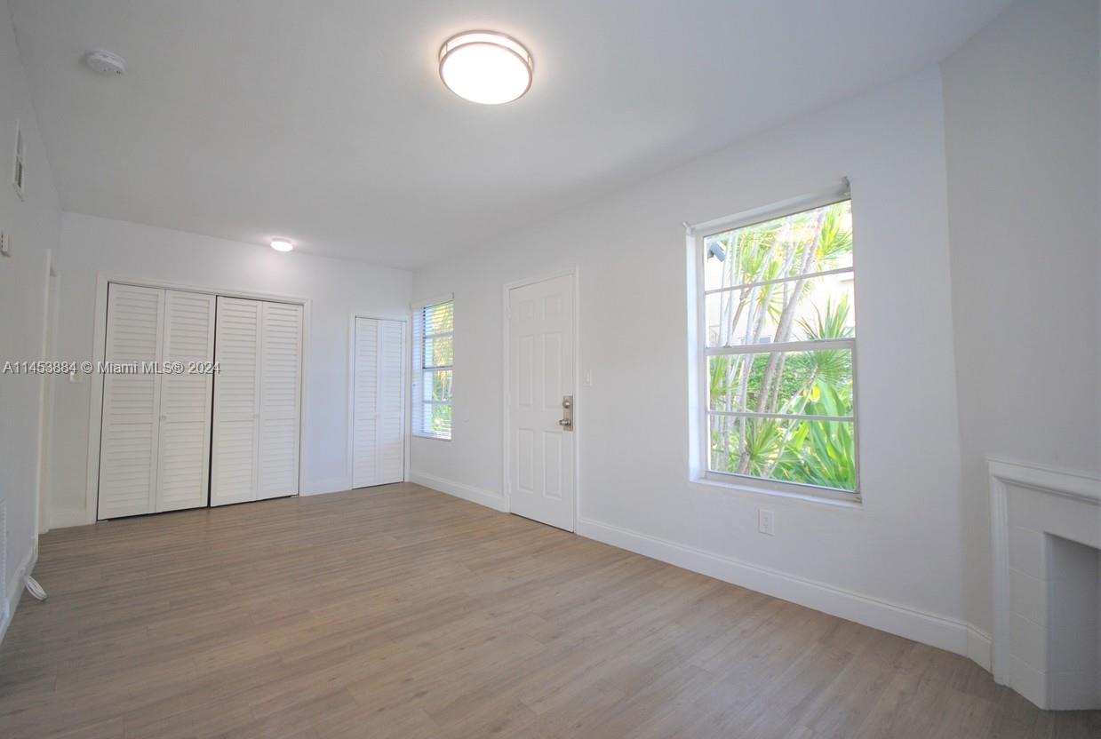 6955 Rue Vendome Miami Beach, FL 33141 - Photo 24 of 43 an empty room with windows
