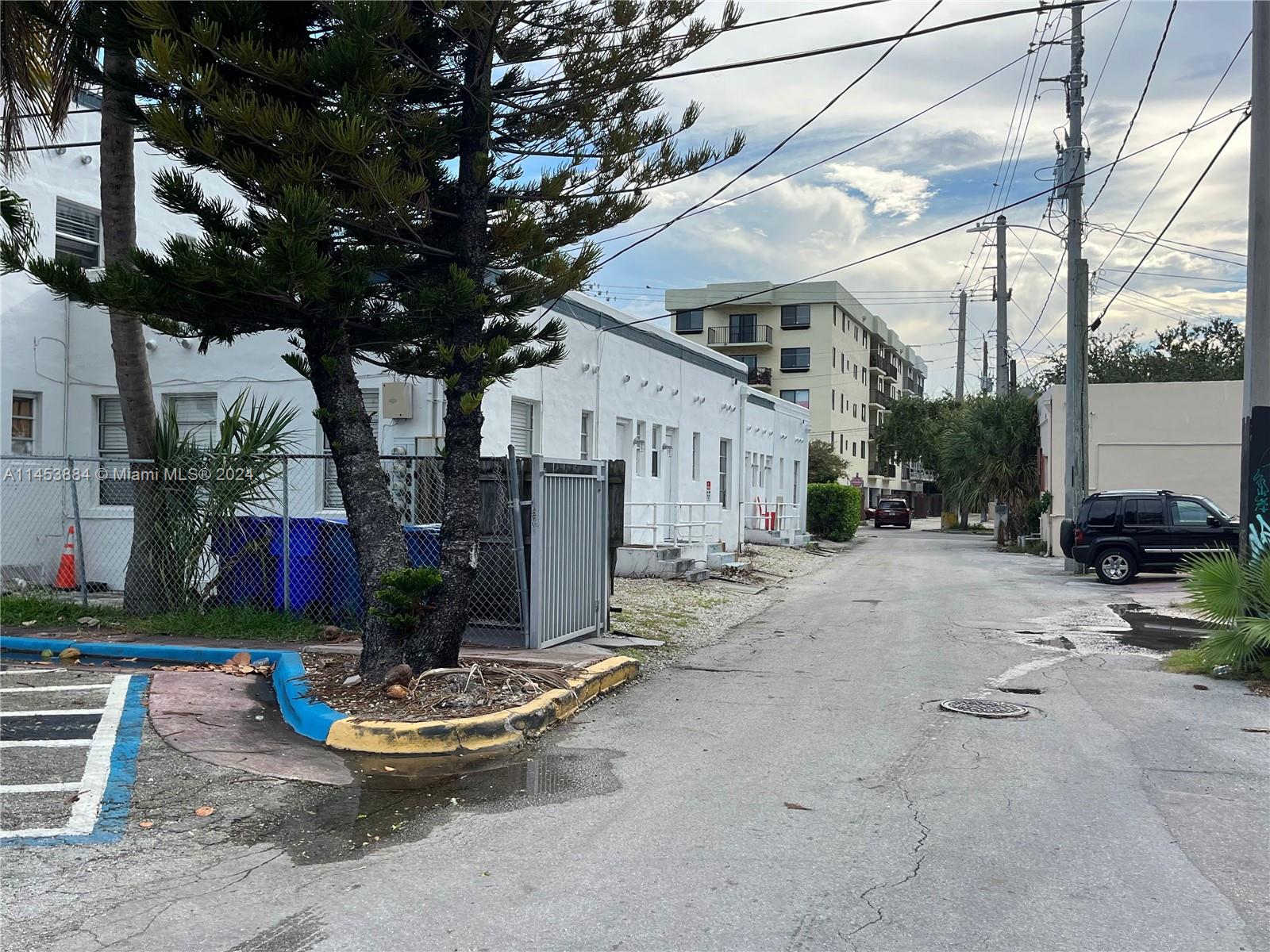6955 Rue Vendome Miami Beach, FL 33141 - Photo 34 of 43 a view of a patio with chairs and potted plants