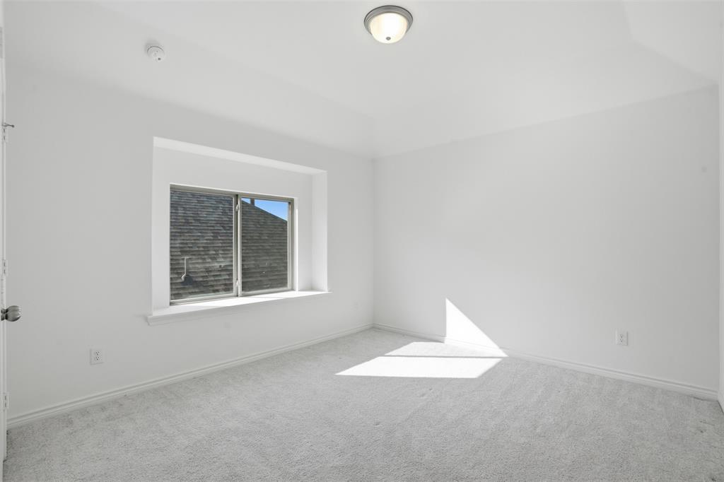 537 Oakmoss Street Little Elm, TX 76227 - Photo 21 of 39 an empty room with a window