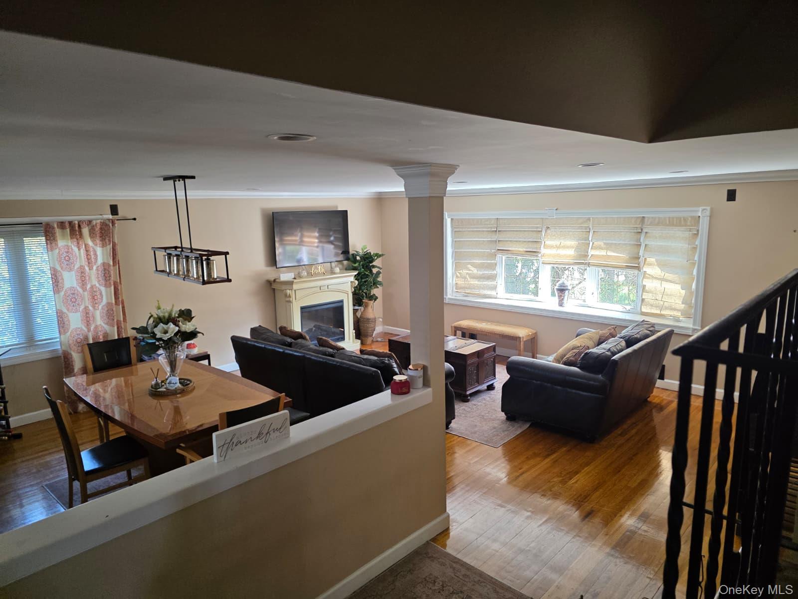 838 Pepperidge Road Westbury, NY 11590 - Photo 3 of 13 a living room with furniture and a window