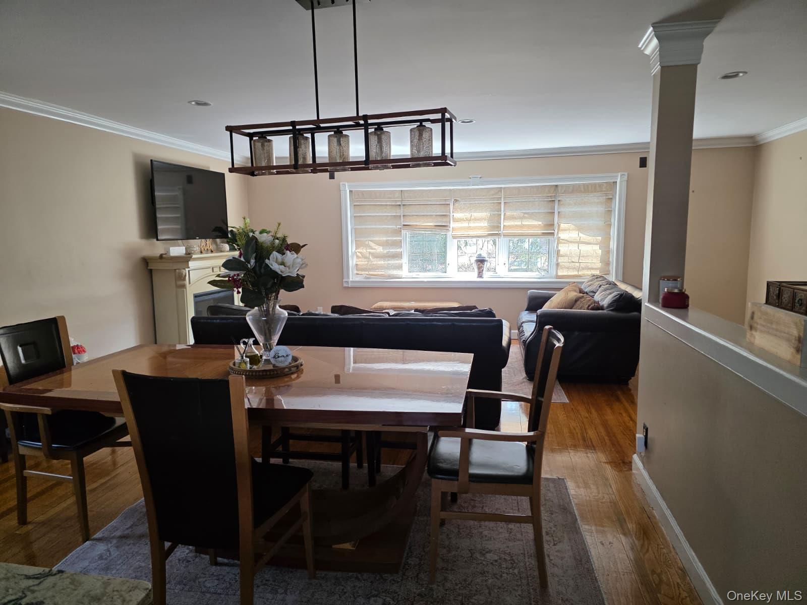 838 Pepperidge Road Westbury, NY 11590 - Photo 6 of 13 a view of a dining room with furniture window and wooden floor