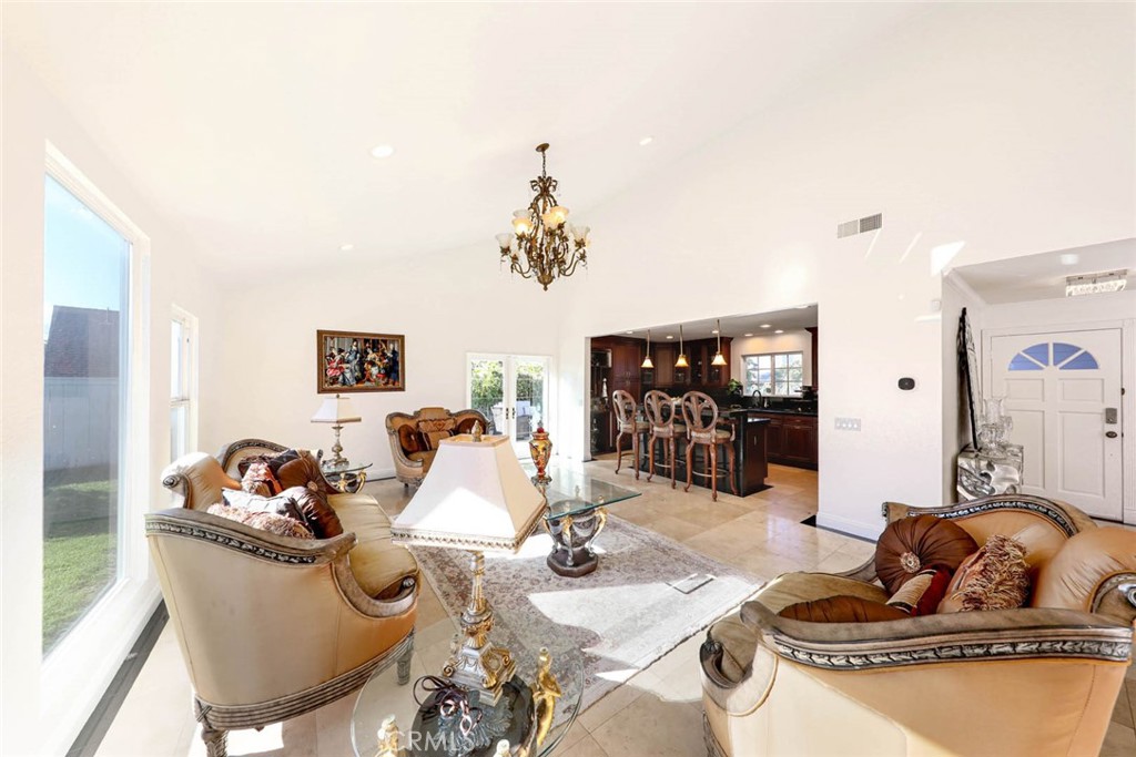 20975 Sequoia Lane Mission Viejo, CA 92691 - Photo 11 of 47 a living room with furniture and a chandelier