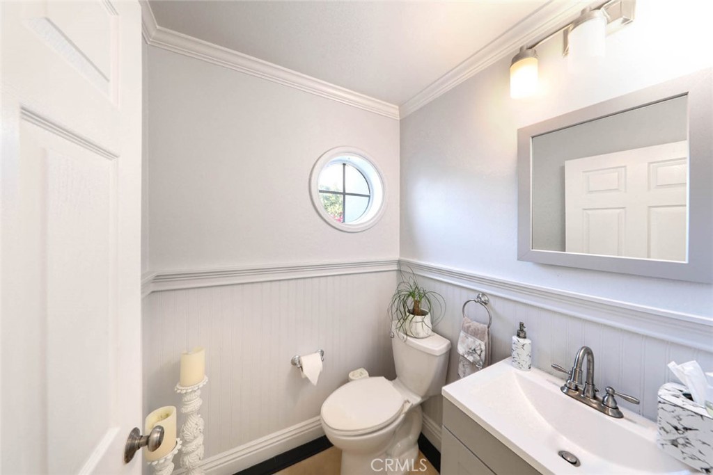20975 Sequoia Lane Mission Viejo, CA 92691 - Photo 18 of 47 a bathroom with a toilet a sink and mirror
