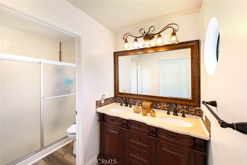 20975 Sequoia Lane Mission Viejo, CA 92691 - Photo 26 of 47 a bathroom with a sink vanity and a mirror