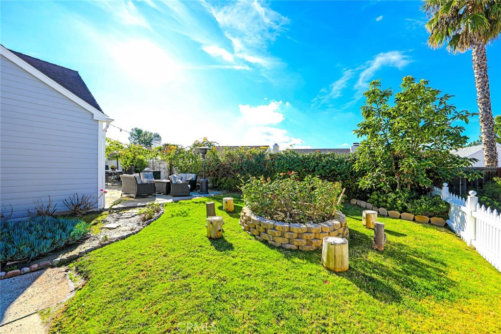 20975 Sequoia Lane Mission Viejo, CA 92691 - Photo 3 of 47 a view of a swimming pool with a garden and plants