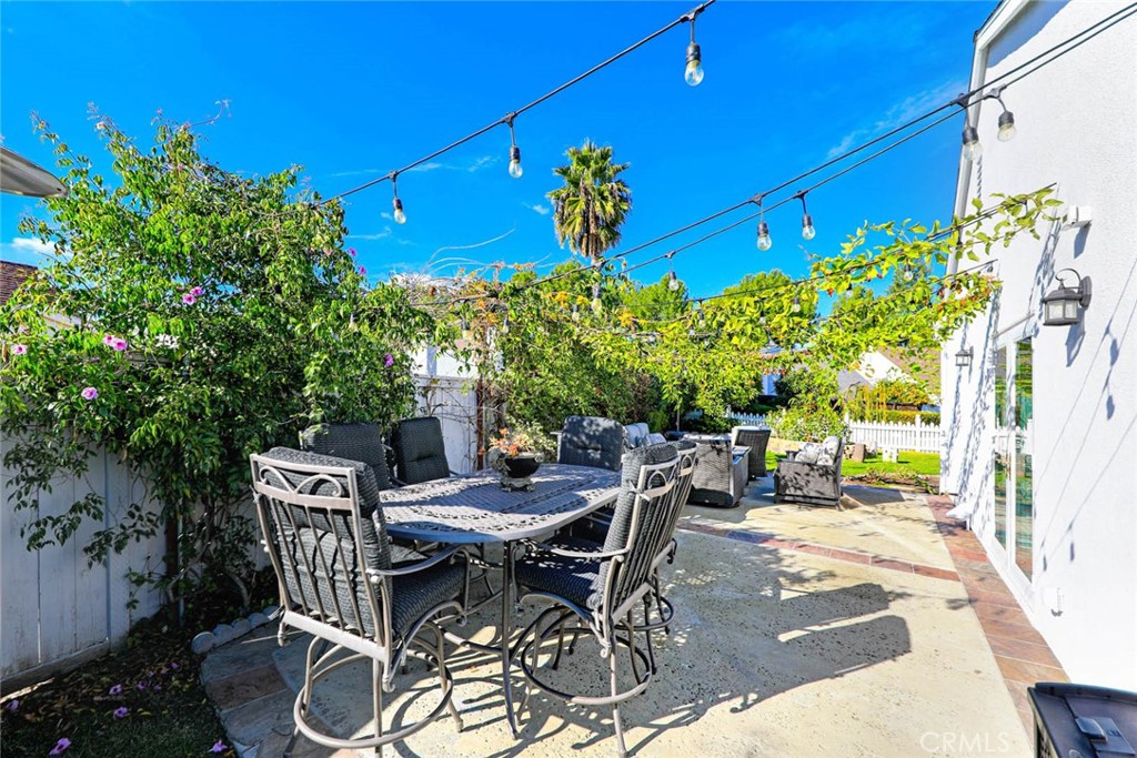 20975 Sequoia Lane Mission Viejo, CA 92691 - Photo 32 of 47 a view of a patio with table and chairs and potted plants