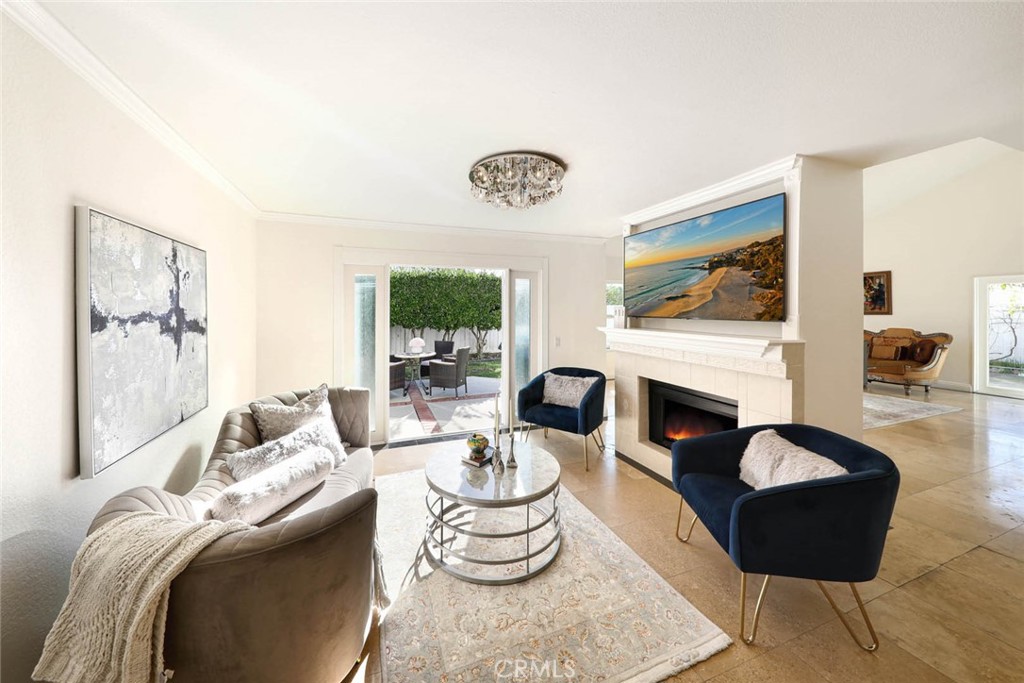 20975 Sequoia Lane Mission Viejo, CA 92691 - Photo 7 of 47 a living room with furniture a fireplace and wall paintings