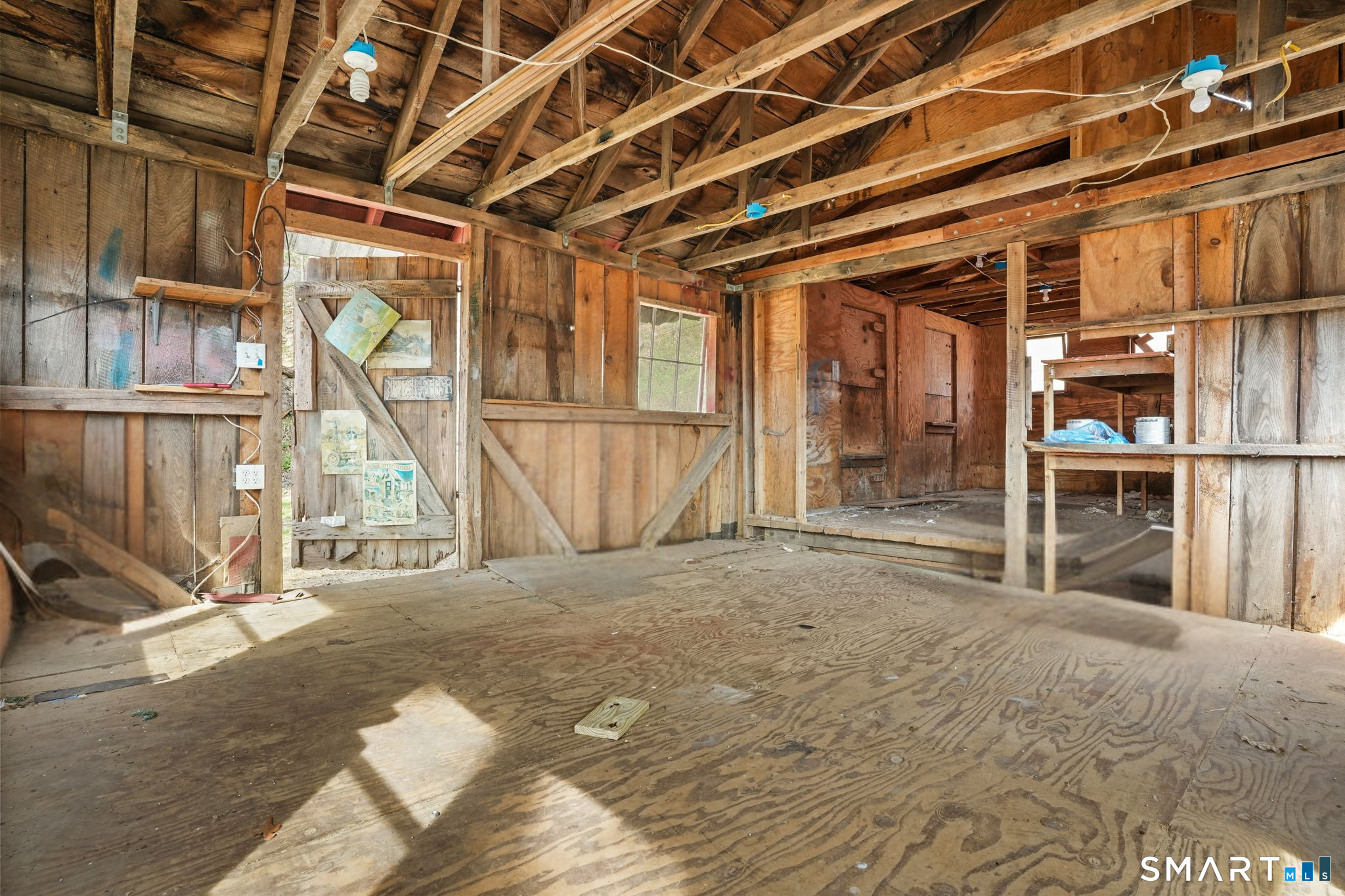60 Riggs Street Oxford, CT 06478 - Photo 11 of 38 2 story barn interior- perfect for hobbies such as painting, woodworking, workshopping!