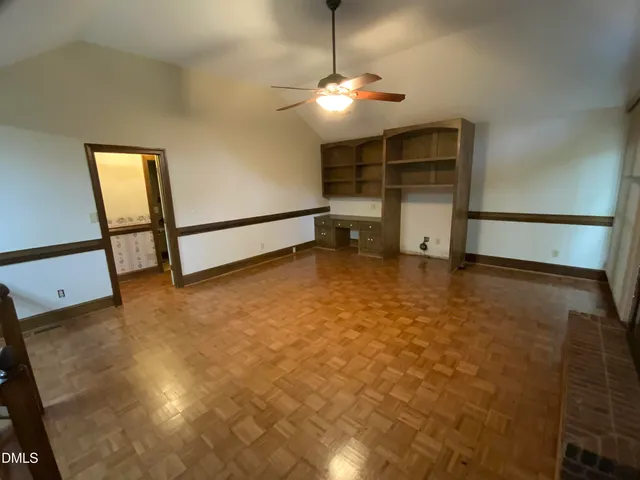 a view of a bathroom with a tub and shower