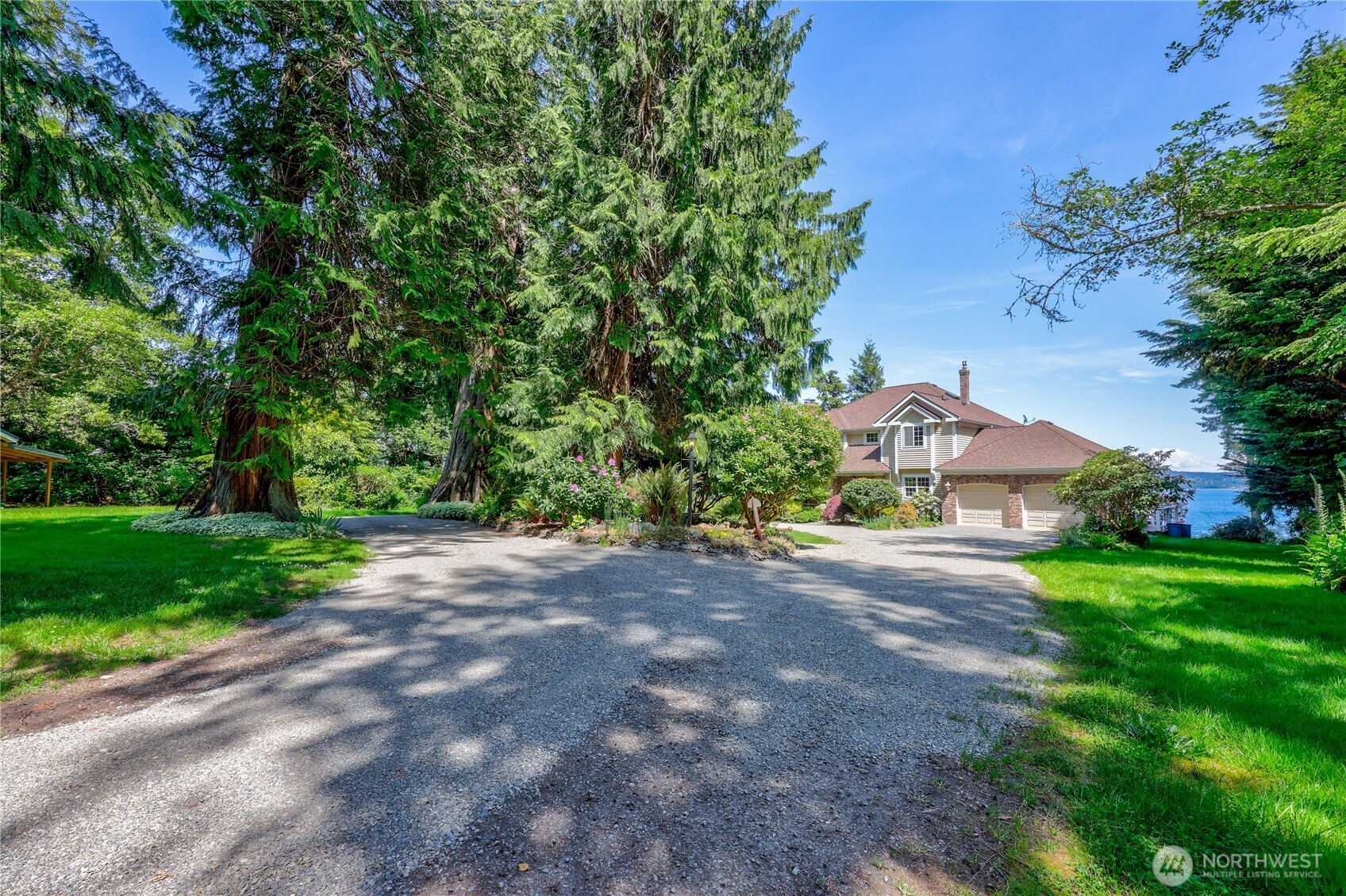 252 Jansen Road Nordland, WA 98358 - Photo 23 of 40 a view of a house with a yard and tree s