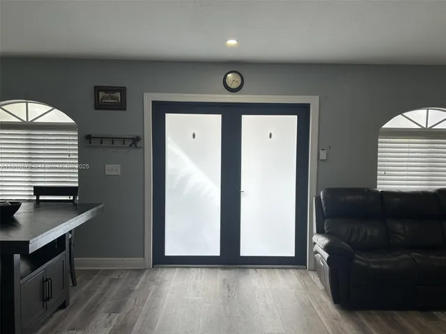 a view of a livingroom with furniture and wooden floor
