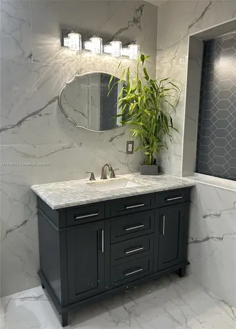 a bathroom with a sink and a mirror