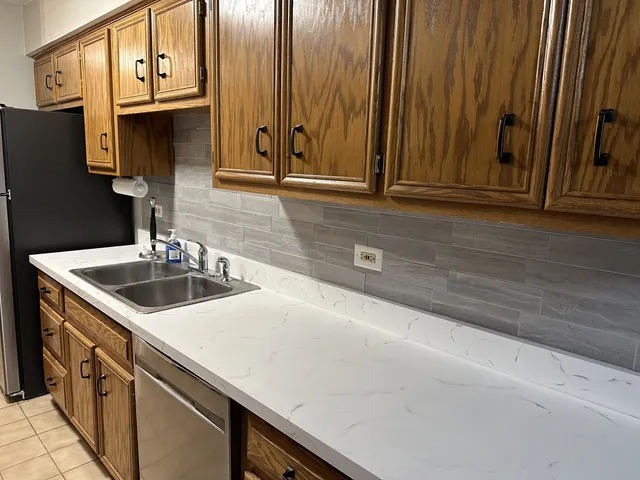 a kitchen with a sink and cabinets