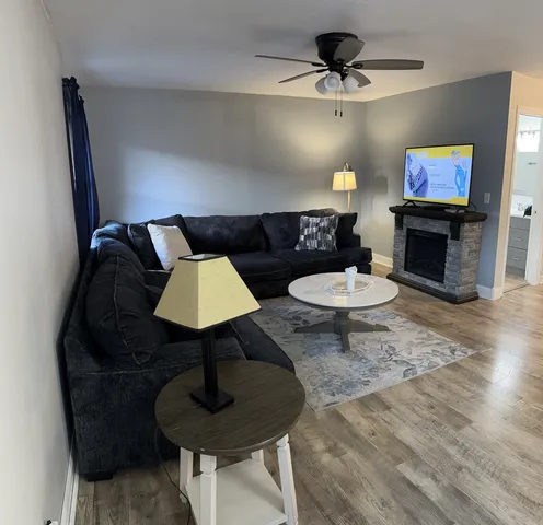 a living room with furniture and a flat screen tv